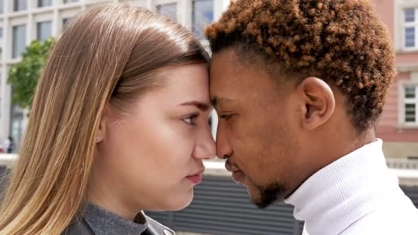 Love between young African male and Caucasian female. Concept of love relationships and unity between different human races. — Stock Video