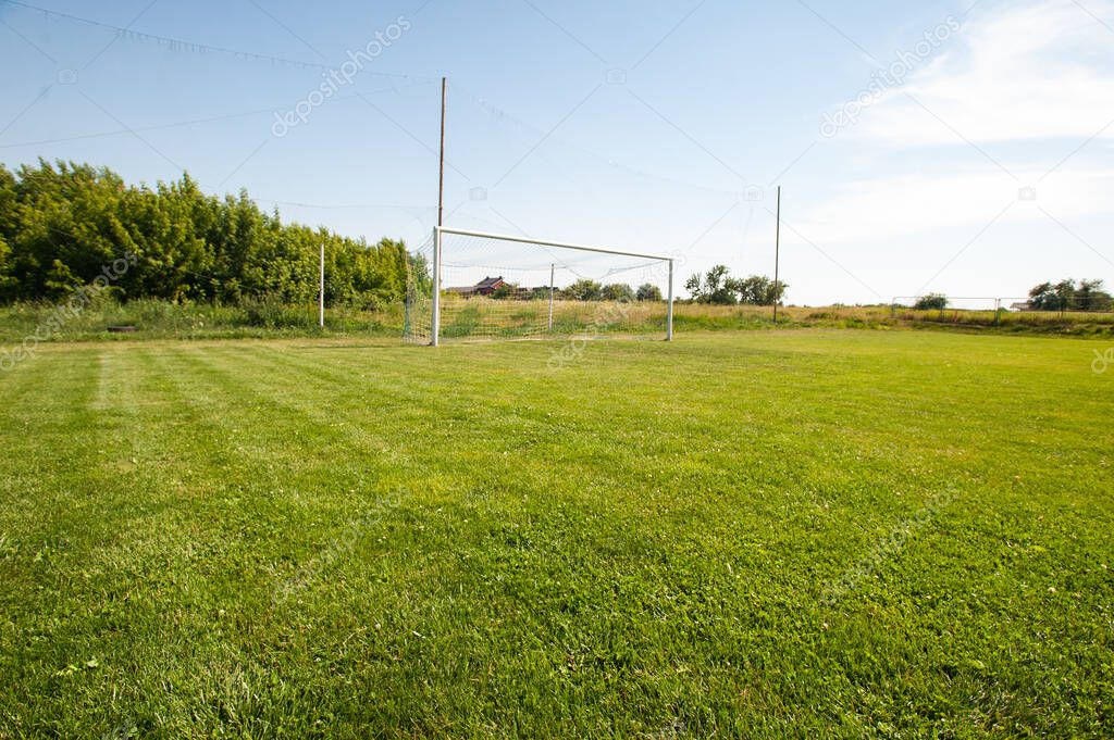 Football gate and football net. Soccer concept. Village stadium.