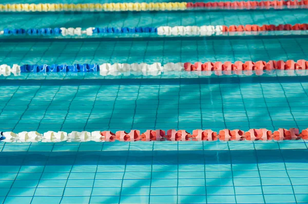 The sports swimming pool. Divided swimming lanes for swimmers,