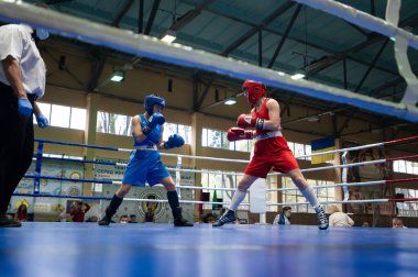 KHARKIV, UKRAINE - OCTOBER 2, 2020: Girls boxers in the fight on the ring during the Ukraine Women Champion Cup 2020 clipart