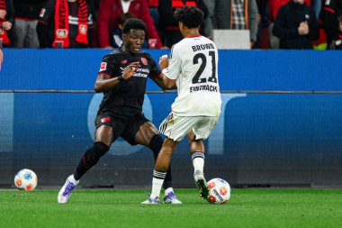 LEVERKUSEN, GERMANY - 12 SEPTEMBER, 2025: Axel Bape, Nathaniel Brown - Bundesliga maçı Bayer 04 Leverkusen vs SG Eintracht Frankfurt at Bayena. 