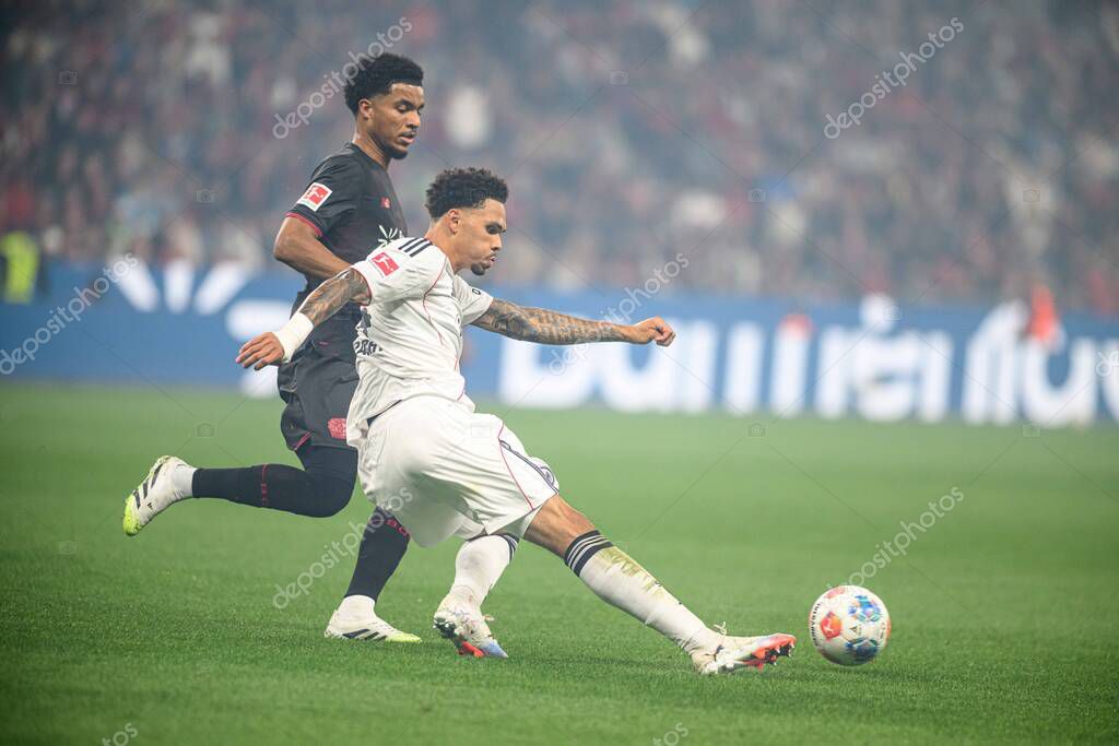 LEVERKUSEN, GERMANY - 12 SEPTEMBER, 2025: Malik Tillman, Nnamdi Collins - The Bundesliga match Bayer 04 Leverkusen vs SG Eintracht Frankfurt at BayArena.