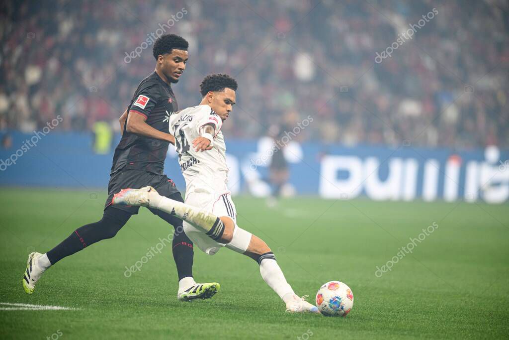 LEVERKUSEN, GERMANY - 12 SEPTEMBER, 2025: Malik Tillman, Nnamdi Collins - The Bundesliga match Bayer 04 Leverkusen vs SG Eintracht Frankfurt at BayArena.