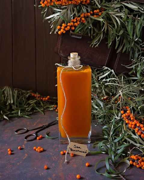 Sea buckthorn syrup in an old bottle