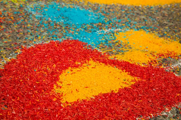 Art craft  raw rice grains asphalt red yellow blue stripes concept creativity — Stock Photo, Image