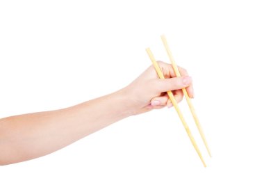 beyaz zemin üzerinde elinde chopsticks