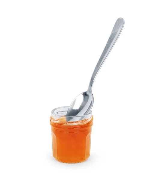 Spoon with tasty apricot jam on white background — Stock Photo, Image