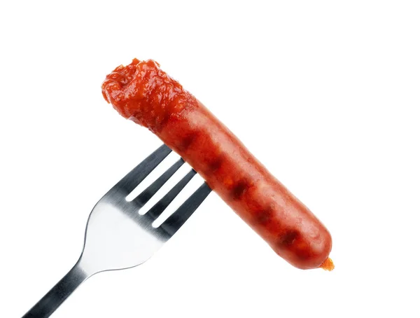 Köstliche Wurst auf einer Gabel, isoliert auf weißem Hintergrund — Stockfoto