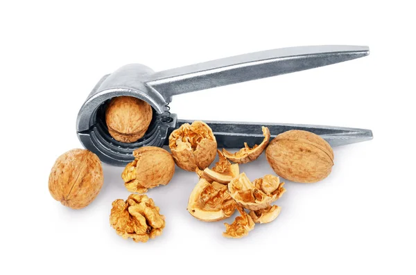 Walnuts and Nutcracker on a white background — Stock Photo, Image