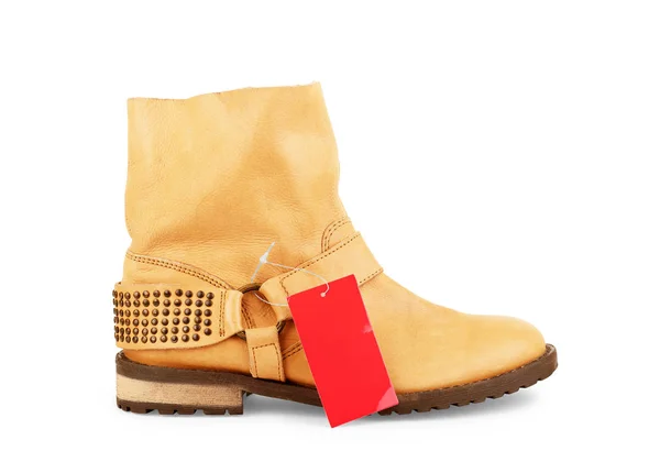 Female brown ankle boots with a tag on a white background — Stock Photo, Image