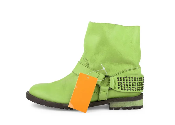 Female ankle boots with a tag on a white background — Stock Photo, Image