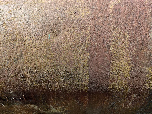 Corroded metal background. Rusted painted metal wall. Rusty metal background with streaks of rust. Rust stains. The metal surface rusted spots. Rystycorrosion.