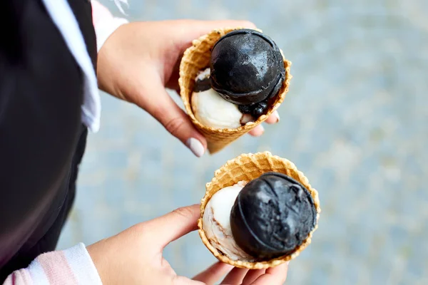 Female Hand Holding Two Charcoal Vanila Ice Cream Waffle Cone — Stock Photo, Image