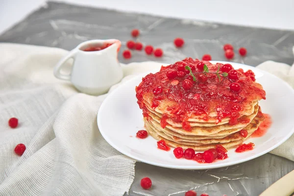 American pancake with jam - berry, viburnum, cranberry