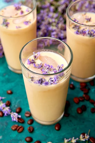 Summer drink iced coffee with lavender in glass