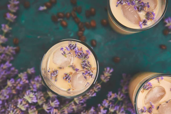Summer drink iced coffee with lavender in glass