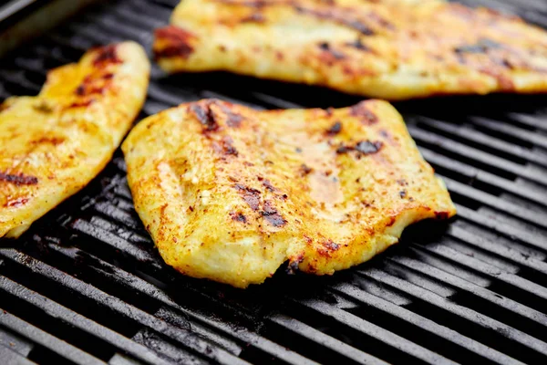 Grilled pike fillet on the gas grill. Grilled seafood. Barbecue fish. Copy space. Healthy food