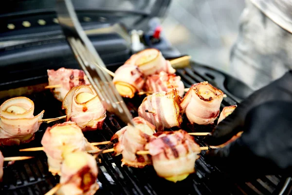 Grilled potato with bacon on gas grill . Grilled food. Barbecue. Copy space. Healthy food.