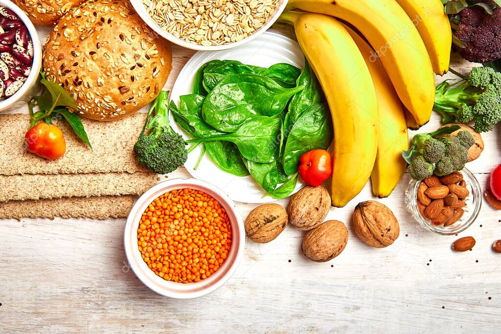 Selection food rich in fiber on white wooden background, Healthy diet food product. Top view, flat lay, copy space.