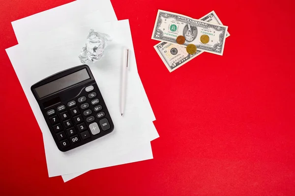 Concept of planning of the budget, business, finance planning, saving money, taxes or accounting concept, bankruptcy, Top view or flat lay money, calculate, list and pen on red background.