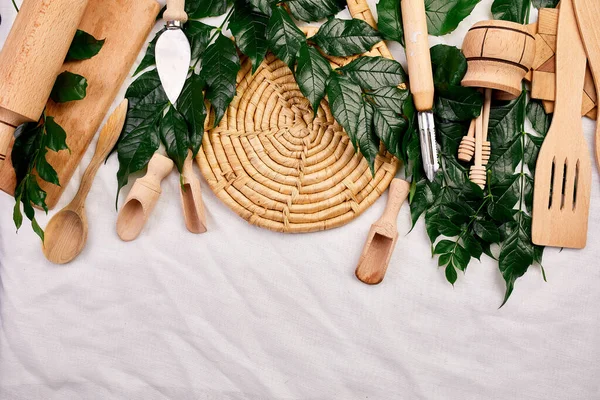 Flat Lay Wooden Kitchen Utensils Green Leaves Cooking Tools Textile — Stock Photo, Image