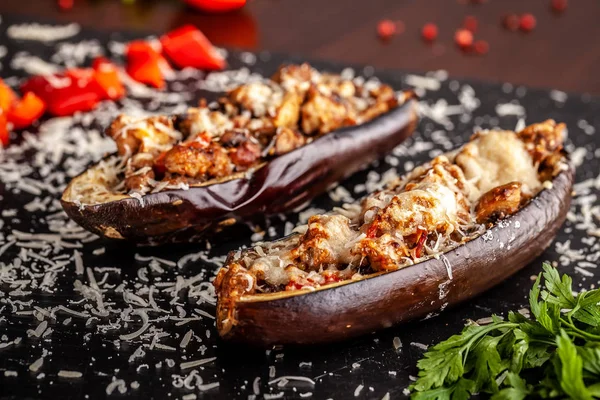 Portuguese cuisine. Baked eggplants with mushrooms, meat, vegetables and parmesan cheese. Copy space, selective focus