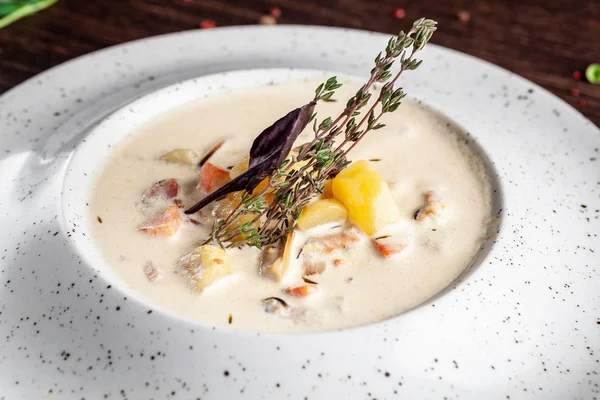 American cuisine concept. American soup Clam chowder with chicken broth and milk, with bacon and mussels. Background image for a menu in restaurants or cafes. copy space