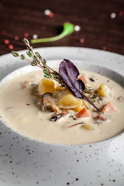 American cuisine concept. American soup Clam chowder with chicken broth and milk, with bacon and mussels. Background image for a menu in restaurants or cafes. copy space