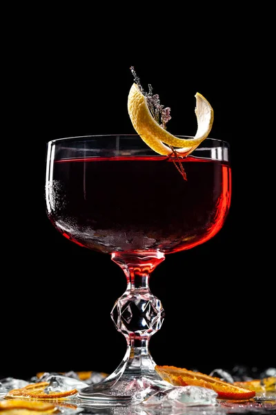 Alcoholic drinks and cocktails for bars and restaurants with ice on a black background in glass glasses. For the menu.