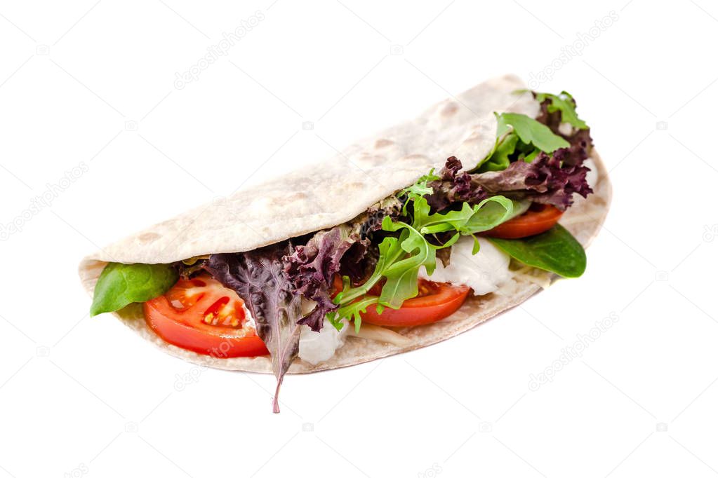 The concept of Italian cuisine. Vegatarian piadina with tomatoes, mozzarella cheese, mix lettuce, arugula and sauce on a white background. Isolate