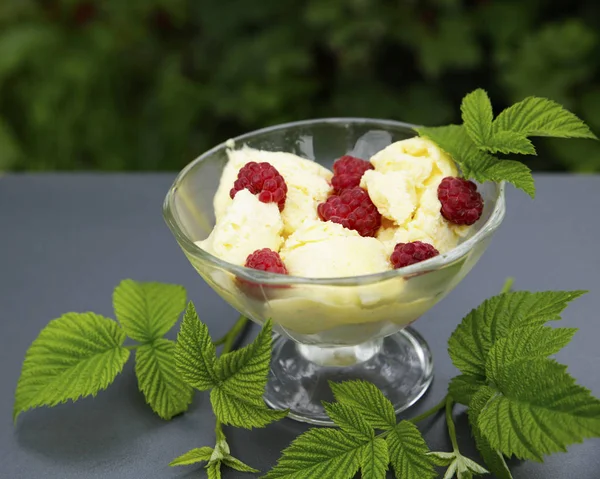 sweet cream ice cream in a crystal bowl with different berries