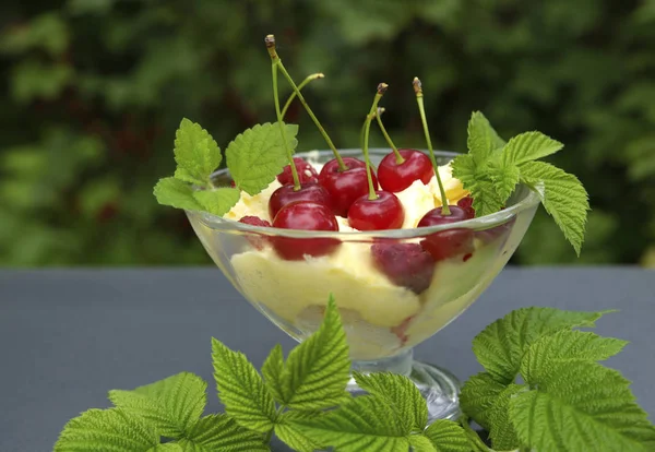 sweet cream ice cream in a crystal bowl with different berries