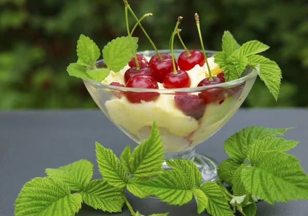 sweet cream ice cream in a crystal bowl with different berries