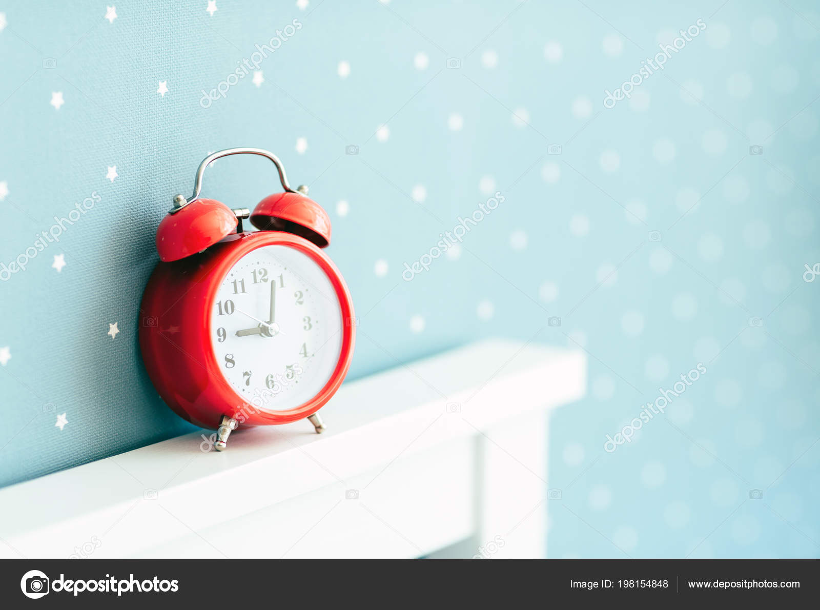 Red Alarm Clock White Bed Blue Wall Nine Hours Stock Photo