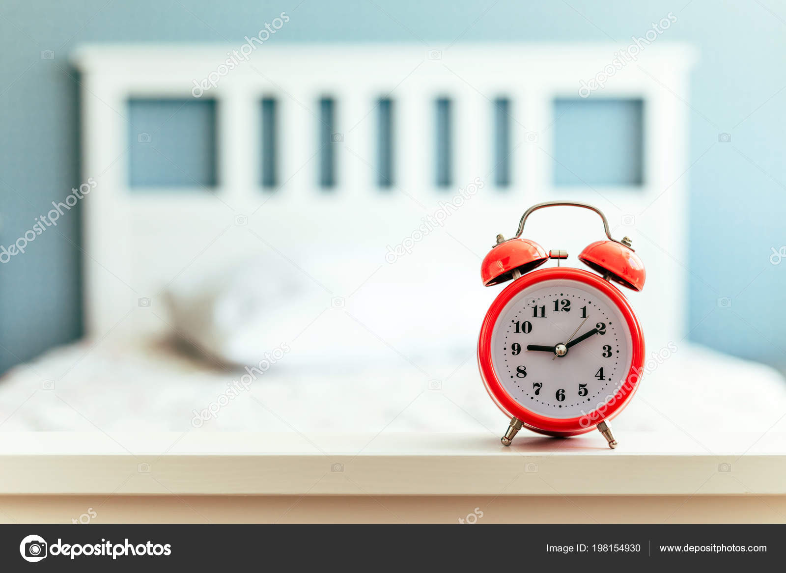 Red Alarm Clock White Bed Blue Wall Nine Hours Stock Photo