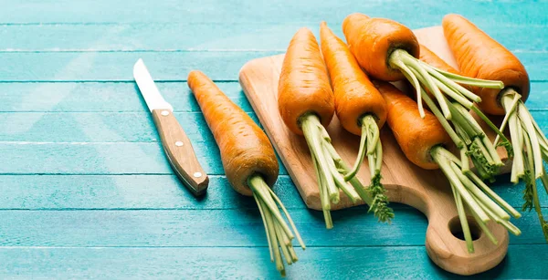 Carrots Blue Wooden Background Cutting Board Knife Fresh Vegetables Carotene — Stock Photo, Image