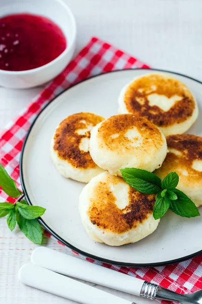 Cottage cheese pancakes, syrniki in a white plate, Gourmet Breakfast
