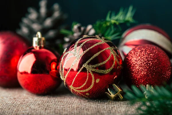 stock image Christmas background, decorations, red balls, cones and fir branches