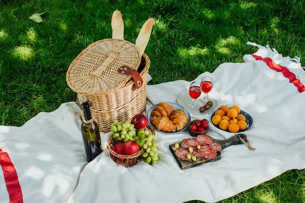 Summer picnic in the park on the green grass