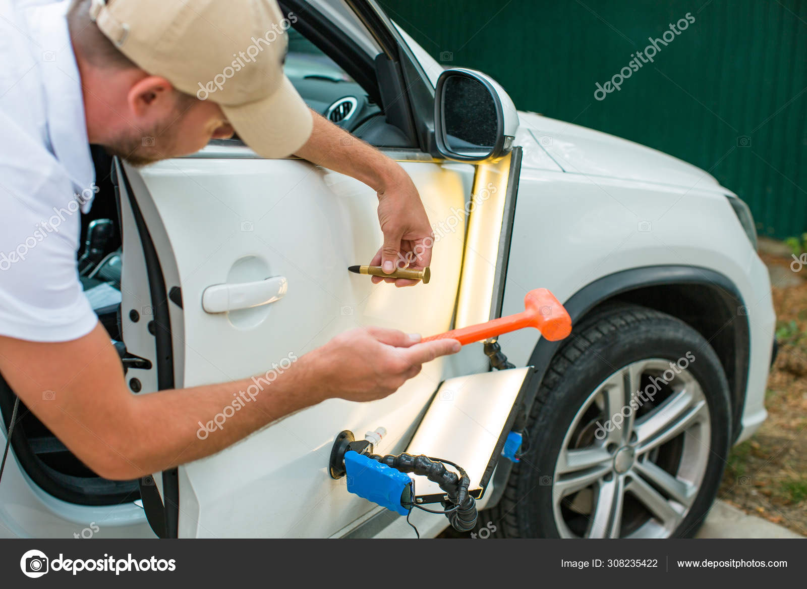 Repairing Car Dent Accident Paintless Dent Repair Stock Photo by  ©yakovlevadaria 308235422