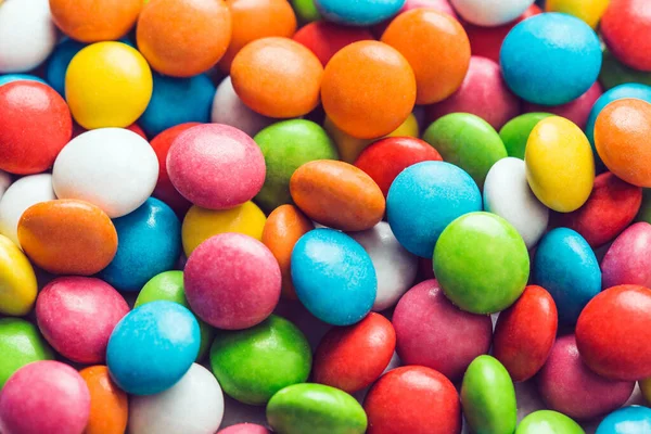 Candies in colored glaze. Sweets background