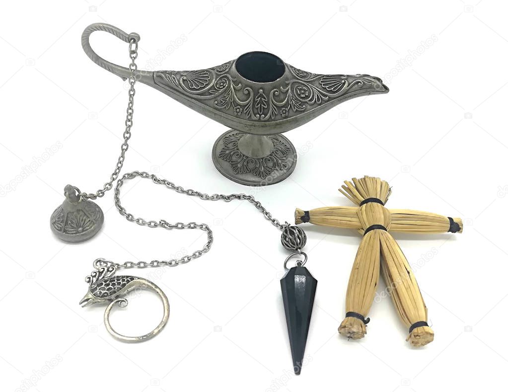 Magic set. Antique silver Aladdins lamp with chain, voodoo doll and magician pendulum. White background. 