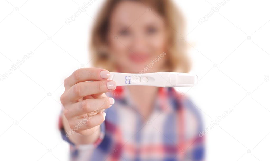 Pregnant test. Happy woman showing a positive pregnancy test