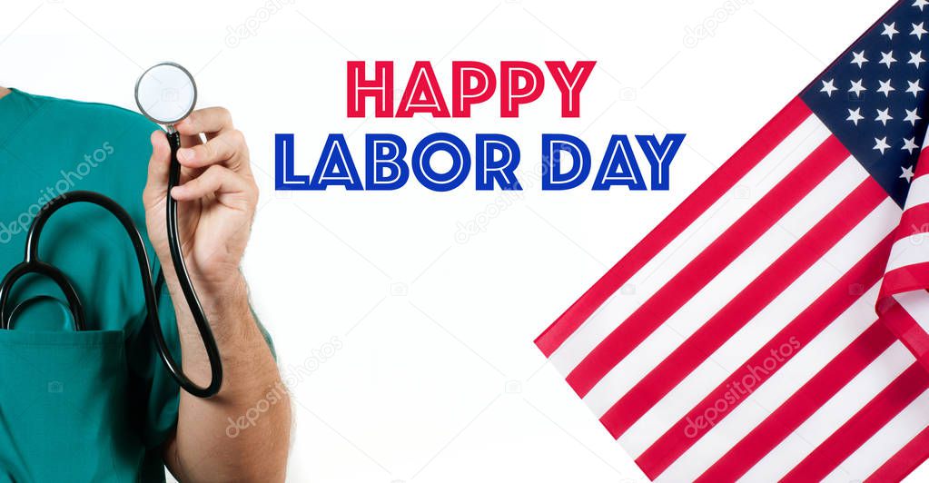 Doctor with a stethoscope in the hand on white background and  USA flag. Happy Labor Day.
