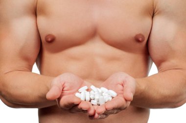Man bodybuilder taking steroids in the form of tablets form of pharma rapid progress in muscle development clipart