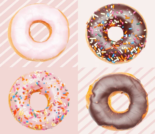Donuts coloridos sobre fondo rosa pastel . —  Fotos de Stock