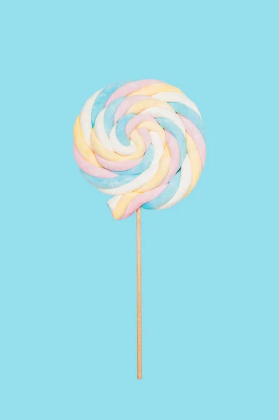 Candy lollipop on pastel blue background — Stock Photo, Image