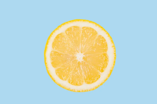 Lemon slice on pastel blue background — Stock Photo, Image