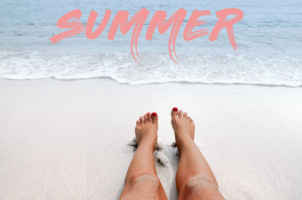 Sea background with lettering summer. Female legs on the beach.