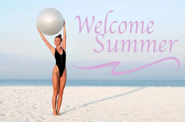Sea background with letters welcome summer. Fitness woman with fit ball on beach outdoors.